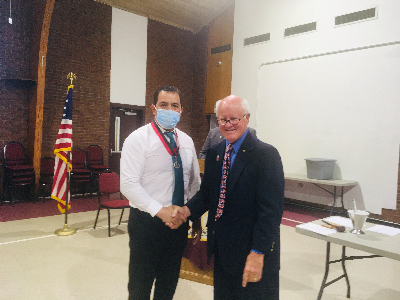 Worthy Trustee Bob Hall Congratulates Worthy Warden Ariel Fores on his Induction